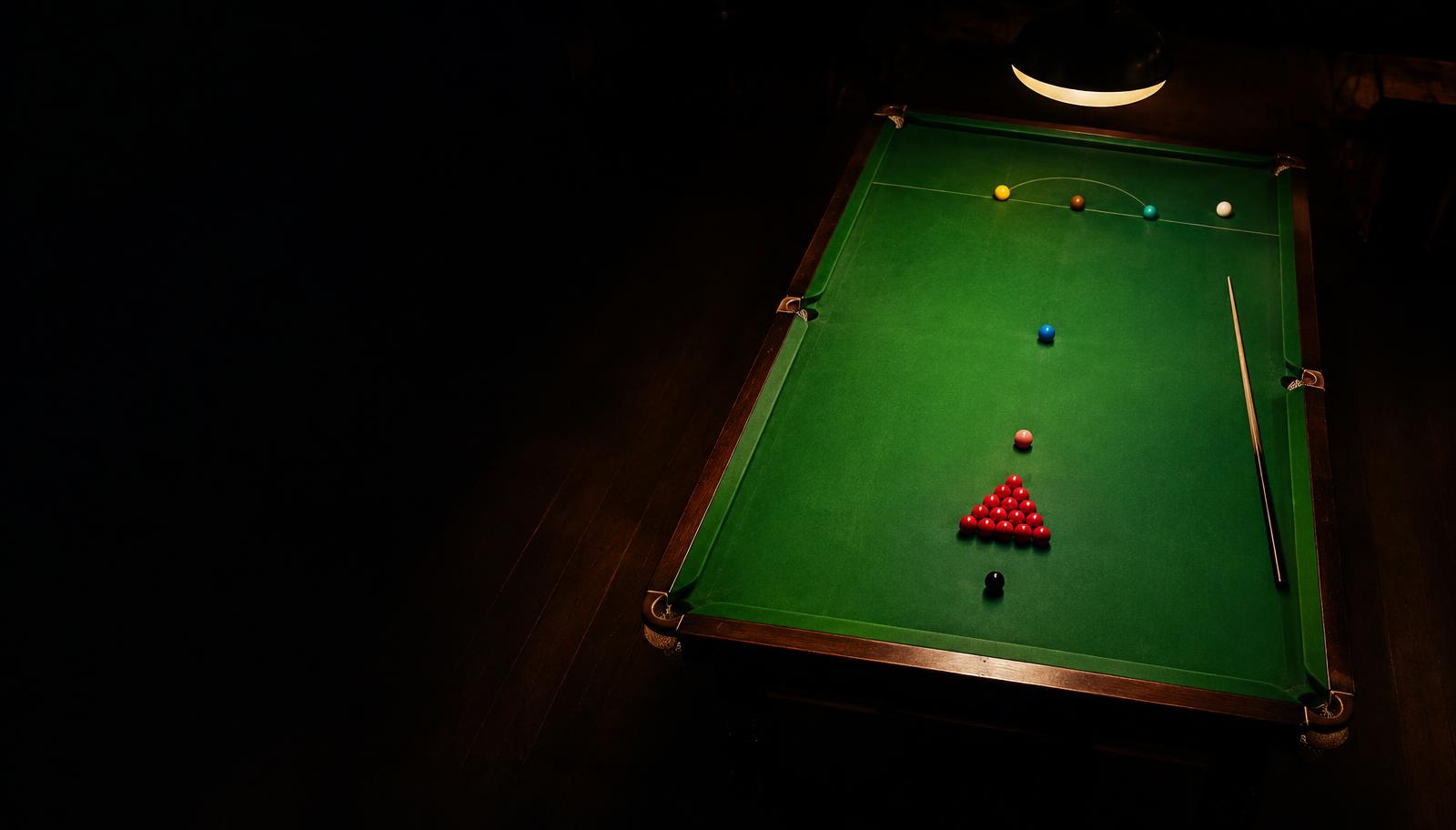 Snooker table under a lamp